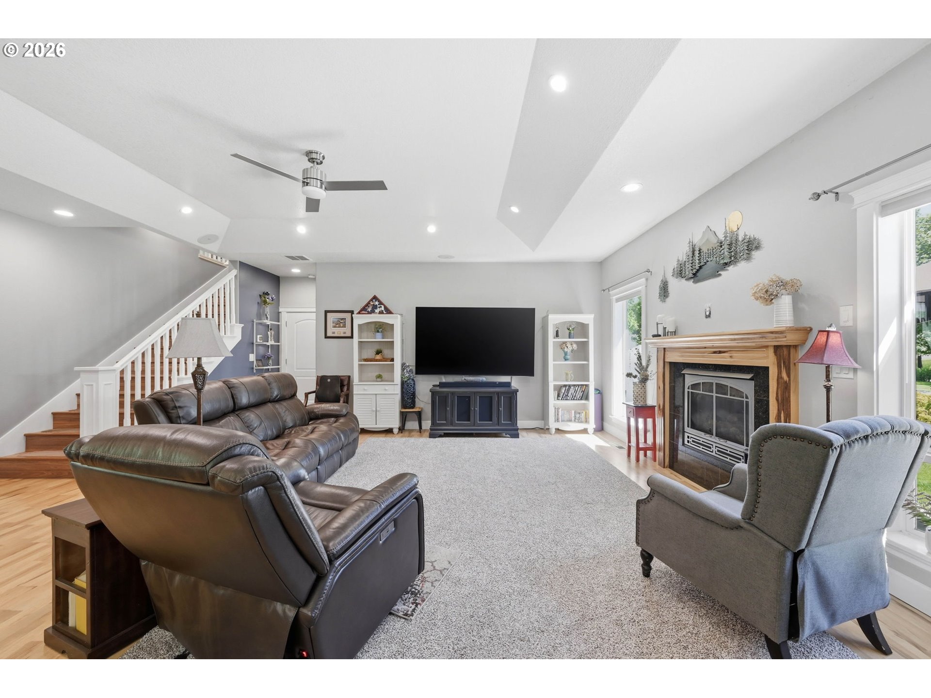 29778 Gimpl Hill Road Eugene, OR 97405 - Photo 7 of 43 a living room with furniture a flat screen tv and a fireplace