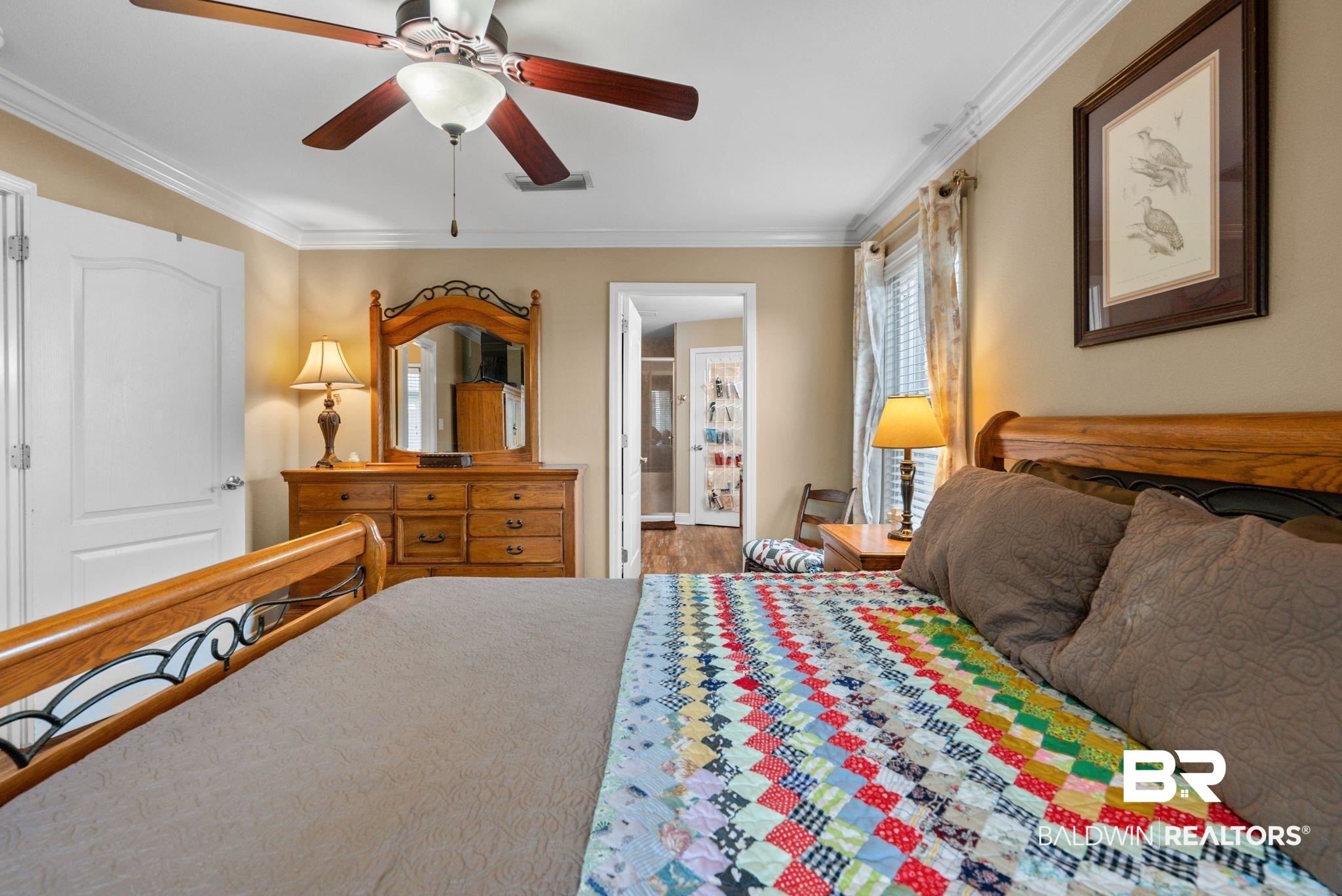 562 Vestige Mews Foley, AL 36535 - Photo 22 of 54 Bedroom featuring a ceiling fan with integrated lighting, crown molding, and neutral wall tones