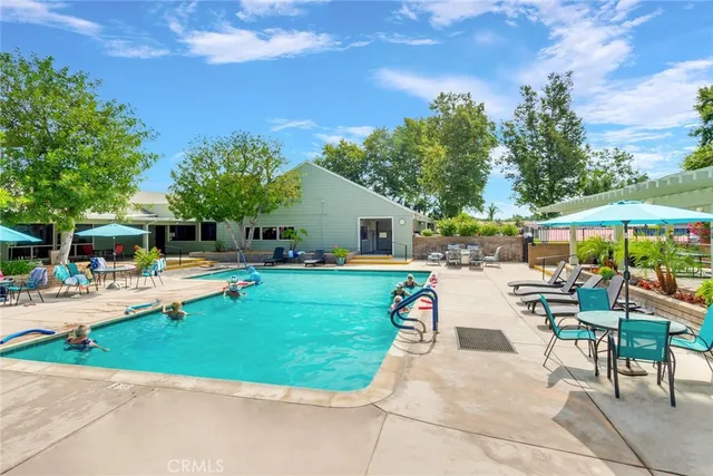 a view of a swimming pool with a patio
