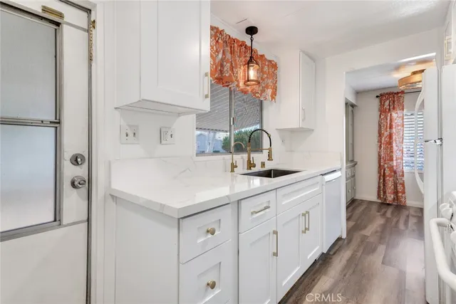 a kitchen with a sink and a window