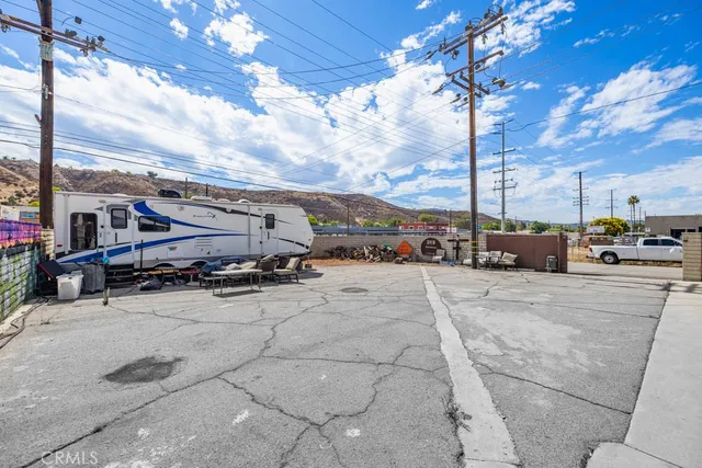 a bed room with a bed and a television