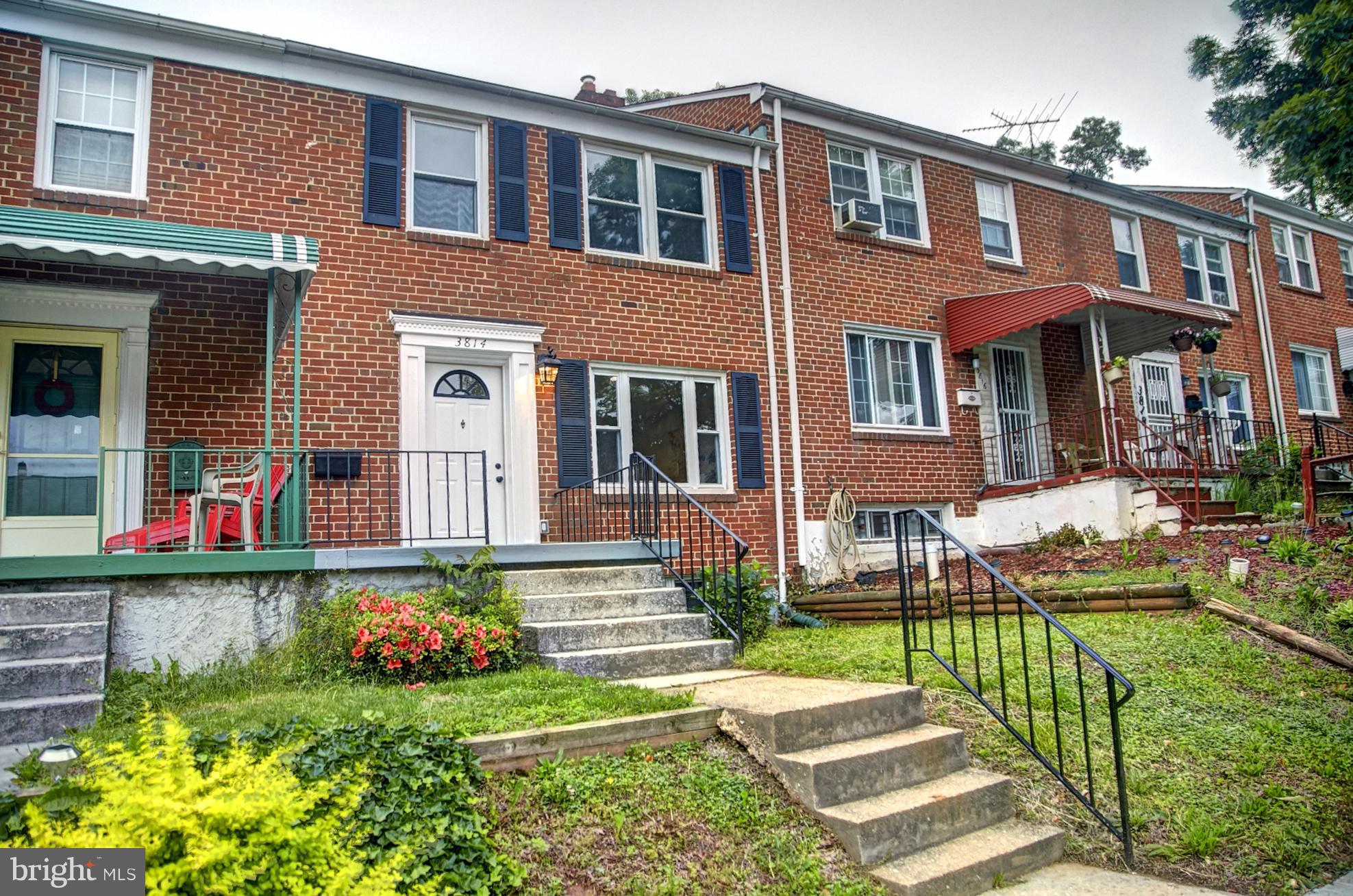 3814 Elkader Road Baltimore, MD 21218 - Photo 1 of 30 a front view of a house with garden