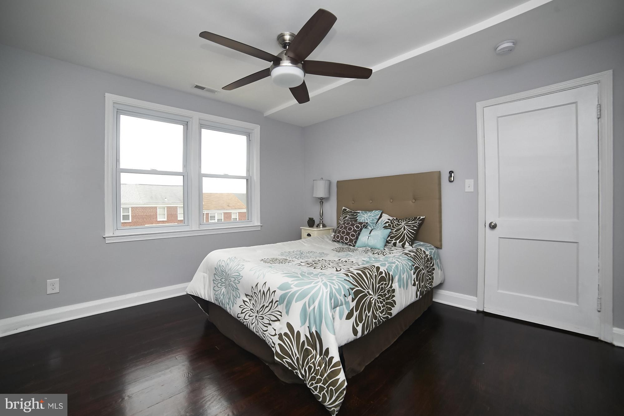3814 Elkader Road Baltimore, MD 21218 - Photo 19 of 30 a bedroom with a bed and a window