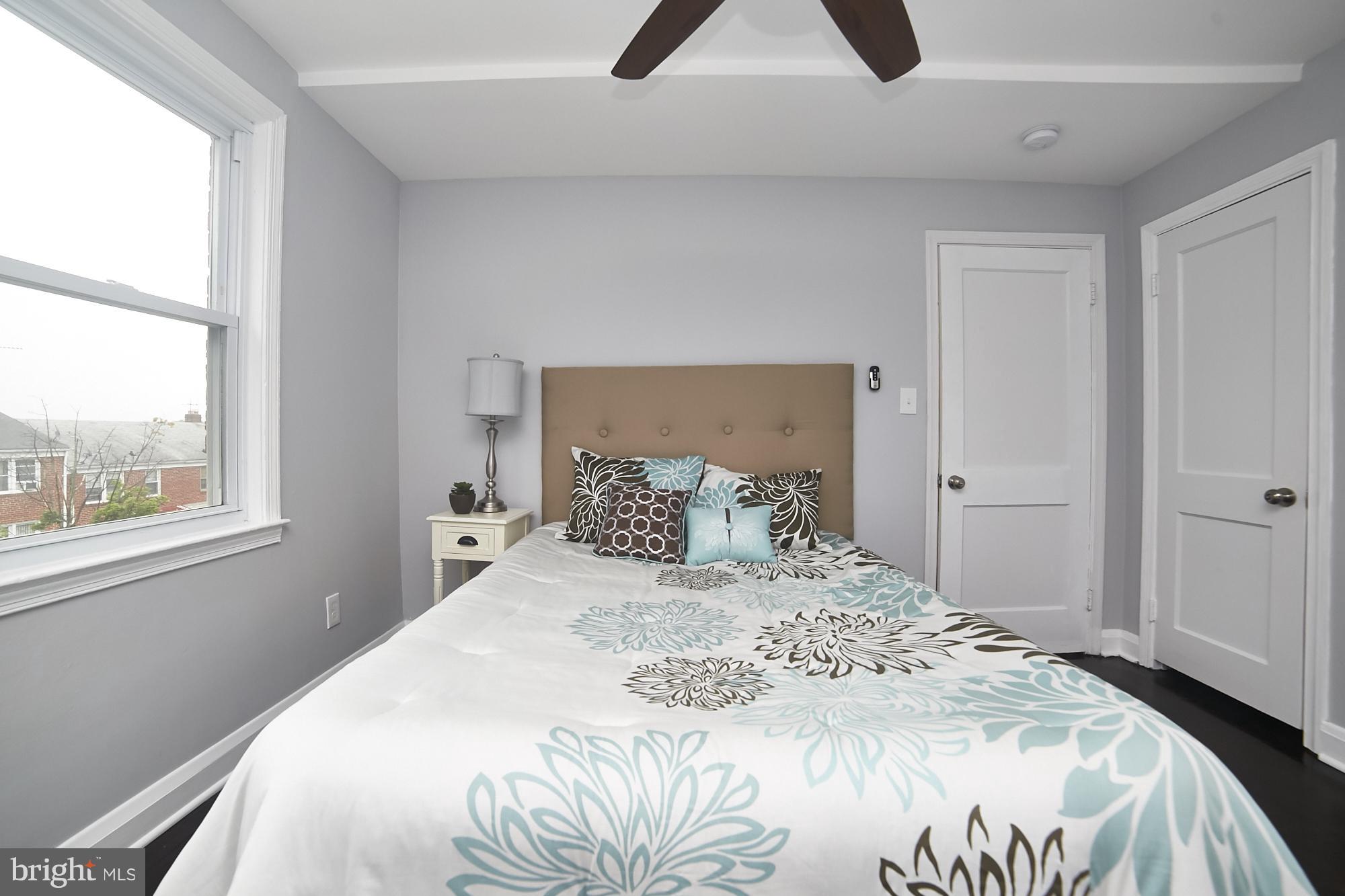 3814 Elkader Road Baltimore, MD 21218 - Photo 20 of 30 a bedroom with a bed and a window