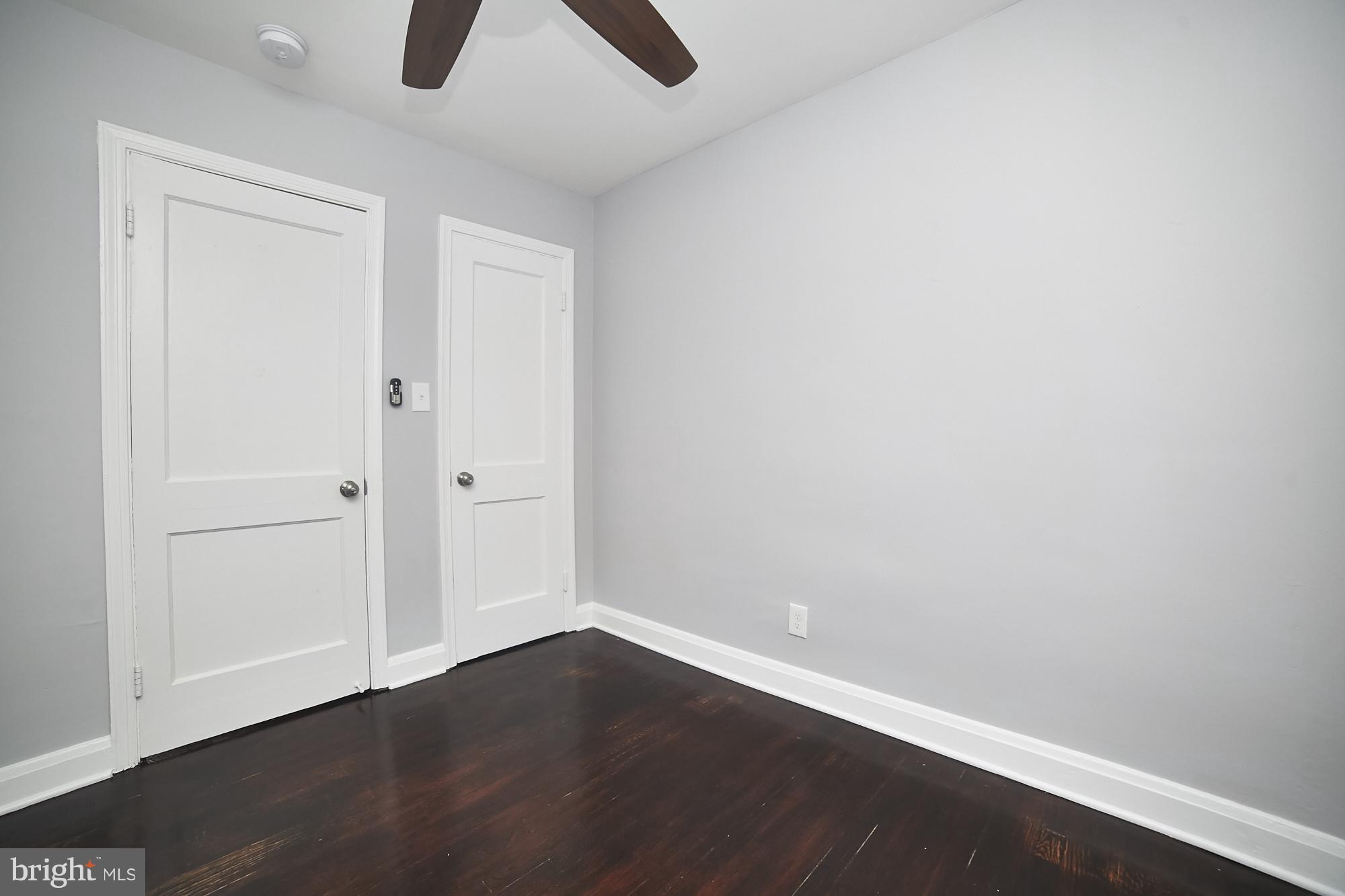 3814 Elkader Road Baltimore, MD 21218 - Photo 24 of 30 a view of an empty room with wooden floor