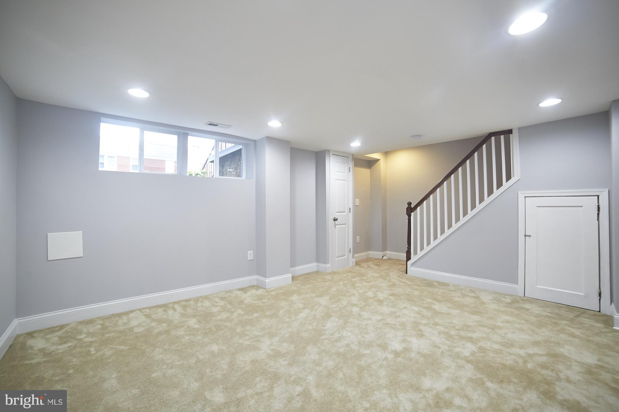 3814 Elkader Road Baltimore, MD 21218 - Photo 26 of 30 a view of an empty room with stairs