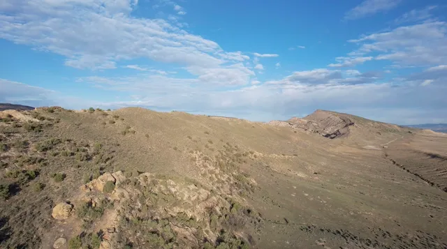 a view of mountain view with mountains in the background