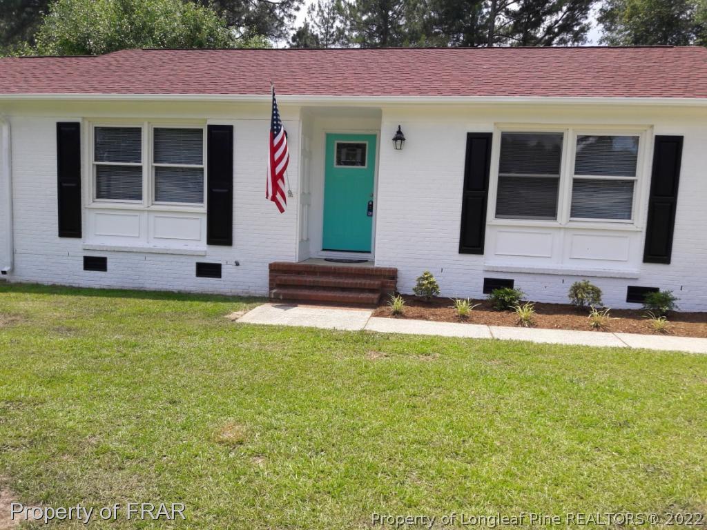 821 Bedford Road Fayetteville, NC 28303 - Photo 13 of 14 a front view of a house with garden