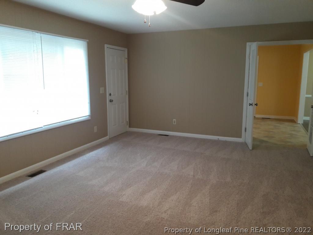 821 Bedford Road Fayetteville, NC 28303 - Photo 7 of 14 a view of an empty room and window