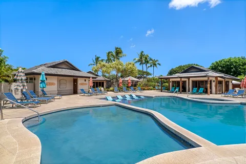 a view of house with outdoor space and swimming pool