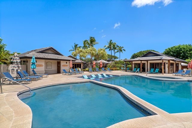 a view of house with outdoor space and swimming pool