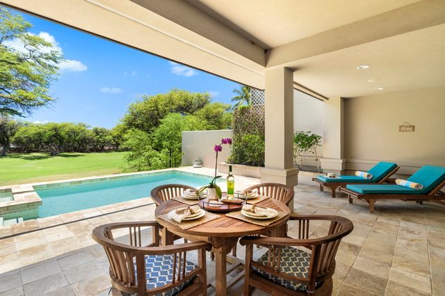 a view of a patio with swimming pool table and chairs
