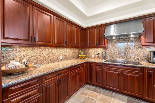 a kitchen with sink and cabinets