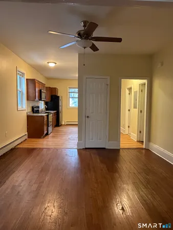 a view of a kitchen with a stove cabinets and wooden floor