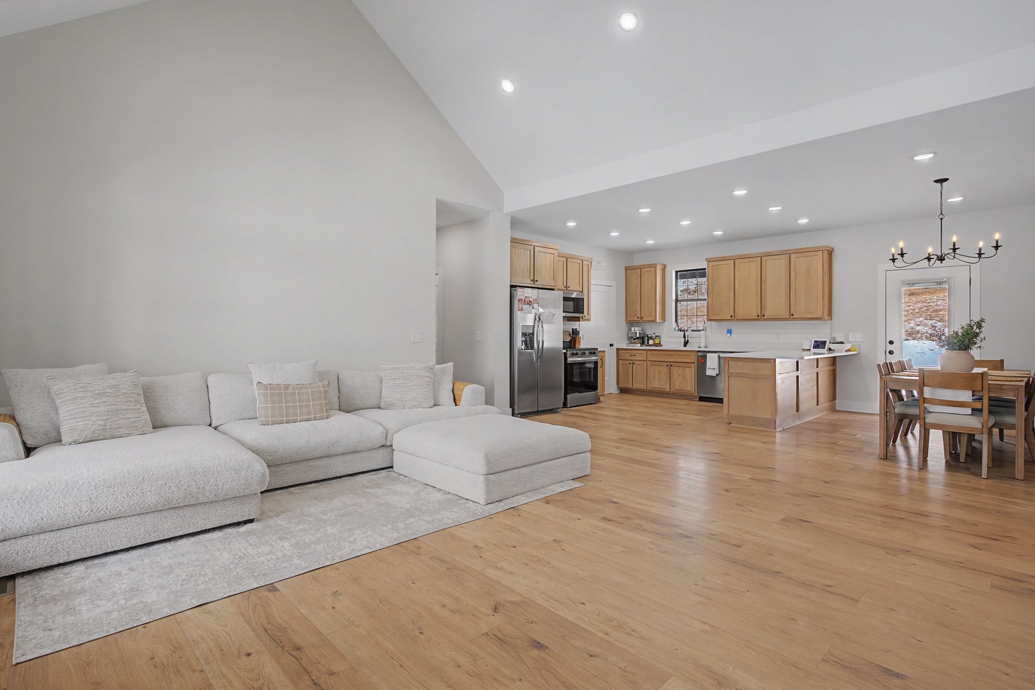 638 Howell Road Westmoreland, TN 37186 - Photo 11 of 41 a living room with furniture and a dining table with kitchen view