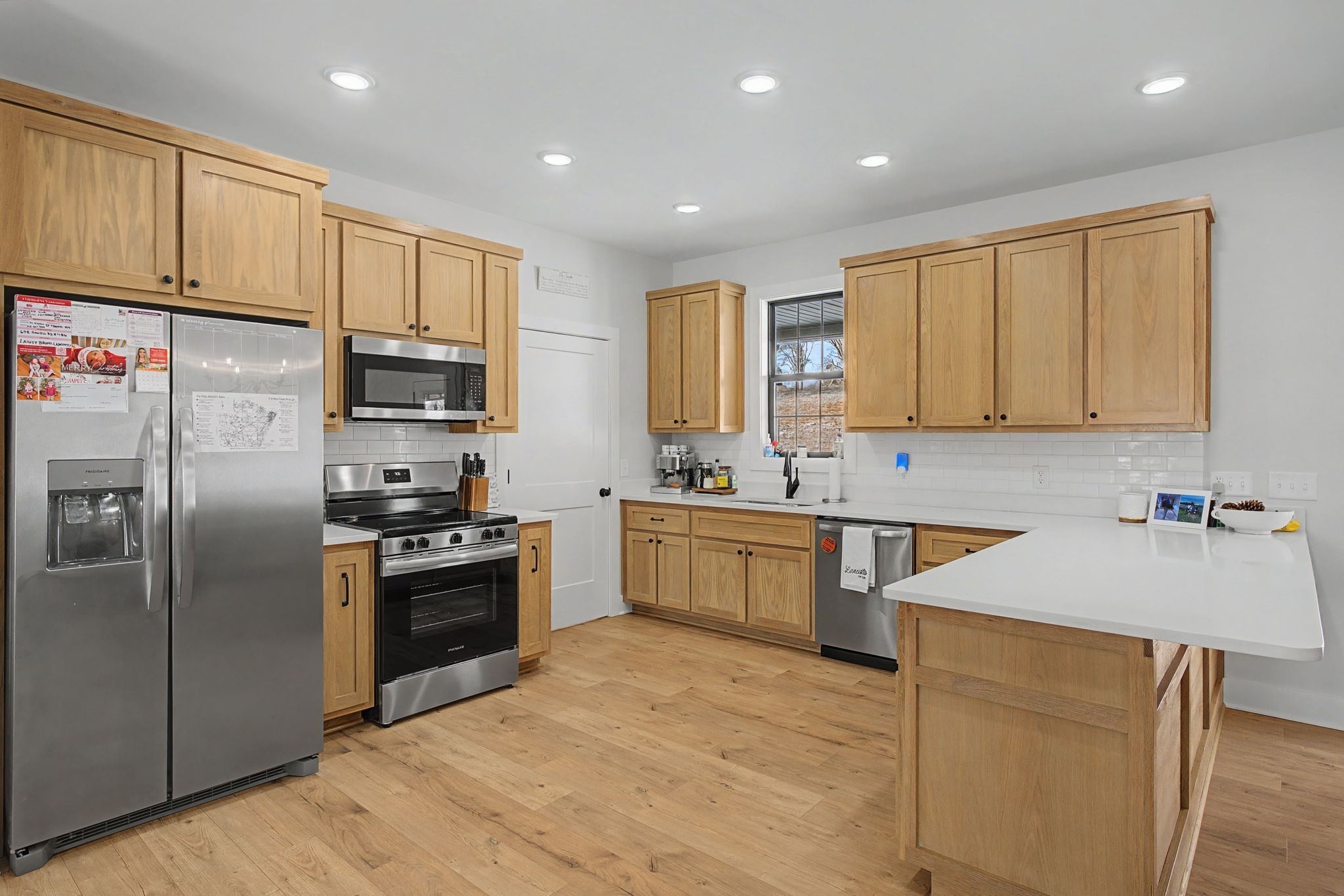 638 Howell Road Westmoreland, TN 37186 - Photo 16 of 41 a kitchen with kitchen island granite countertop a sink stainless steel appliances and cabinets