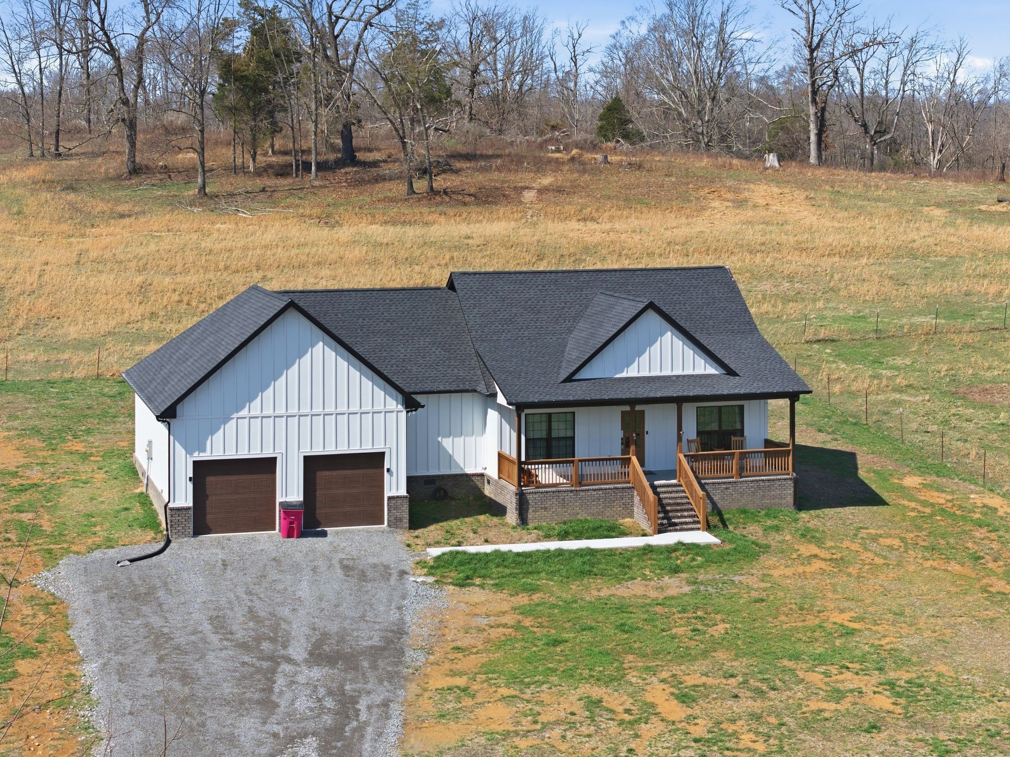 638 Howell Road Westmoreland, TN 37186 - Photo 3 of 41 a front view of a house with a yard outdoor seating and covered with snow in front of house