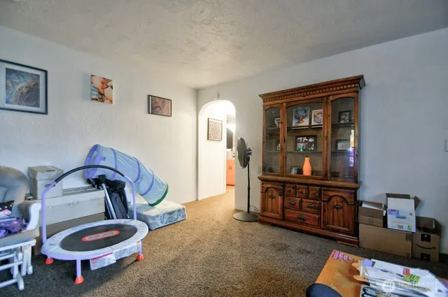 a room with furniture and wooden floor