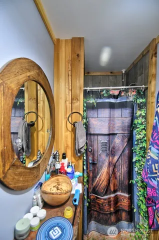 a room with furniture and a mirror