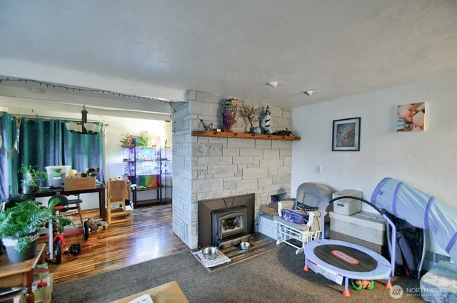 a living room with furniture and a fireplace