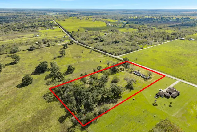a view of a pool with a table and chairs in the balcony