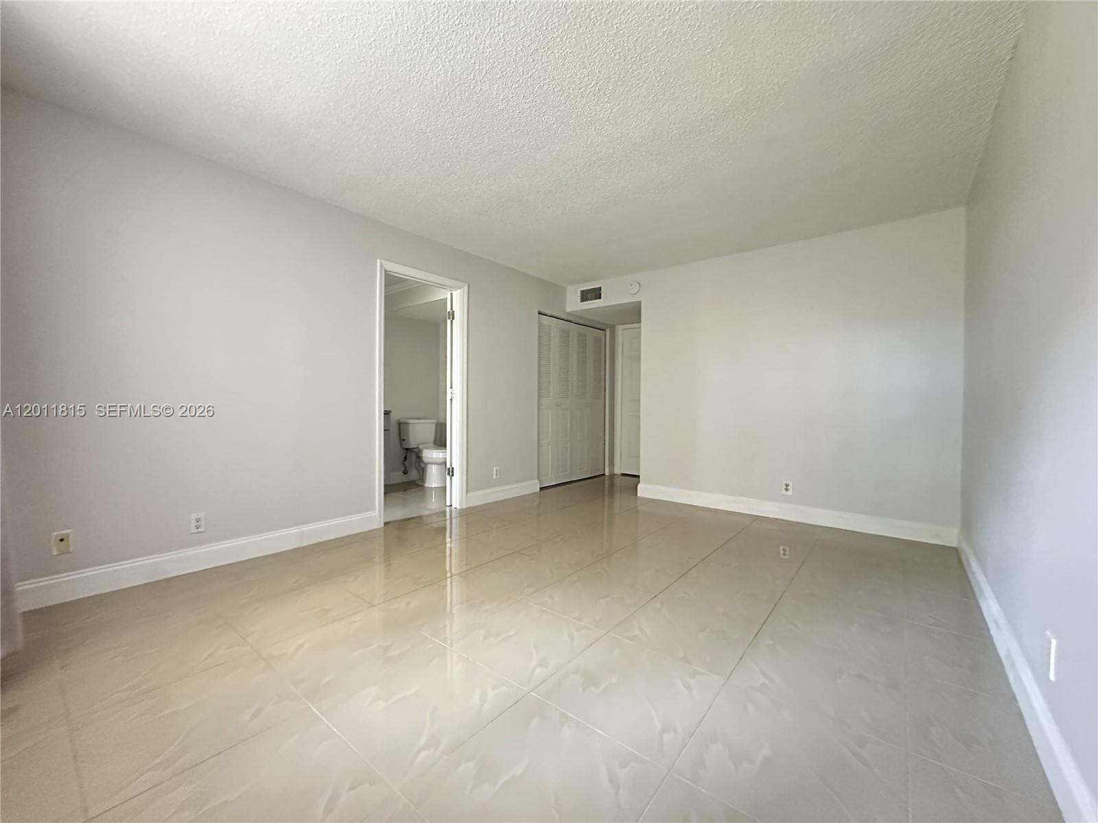 9370 Southwest 8th Street, Unit 107 Boca Raton, FL 33428 - Photo 4 of 17 Primary Bedroom