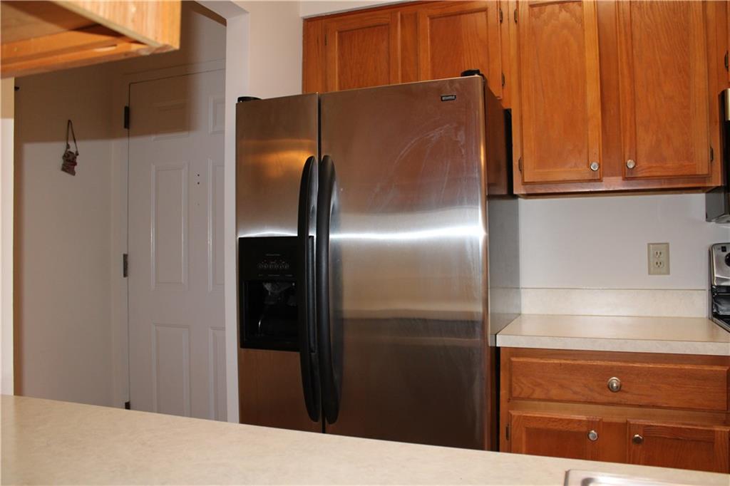 300 Johnson Ferry Road, Unit B802 Atlanta, GA 30328 - Photo 4 of 23 a kitchen with metallic refrigerator freezer and a dishwasher