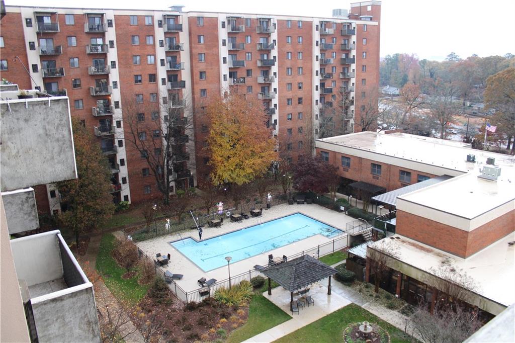 300 Johnson Ferry Road, Unit B802 Atlanta, GA 30328 - Photo 10 of 23 a view of a house with backyard water fountain and large tree
