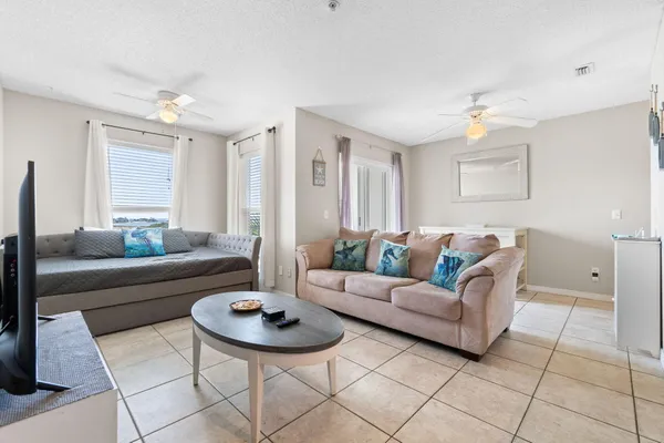 a living room with furniture and a large window