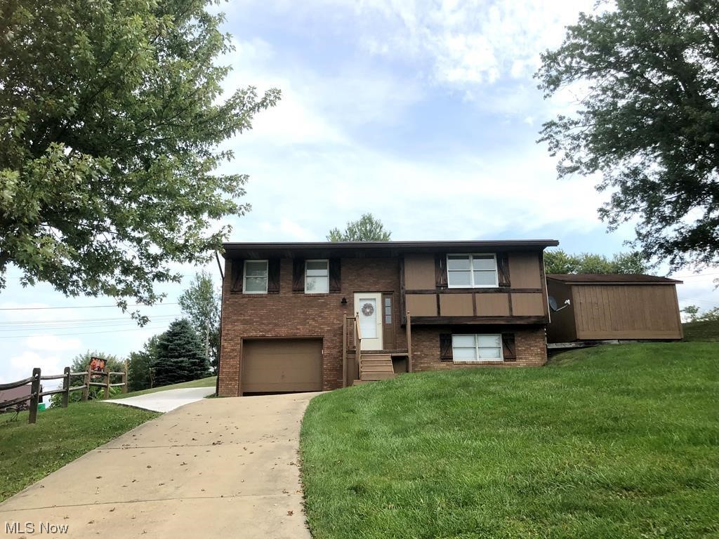 756 Northview Road Wellsburg, WV 26070 - Photo 1 of 25 Bi-level home featuring a front yard and garage