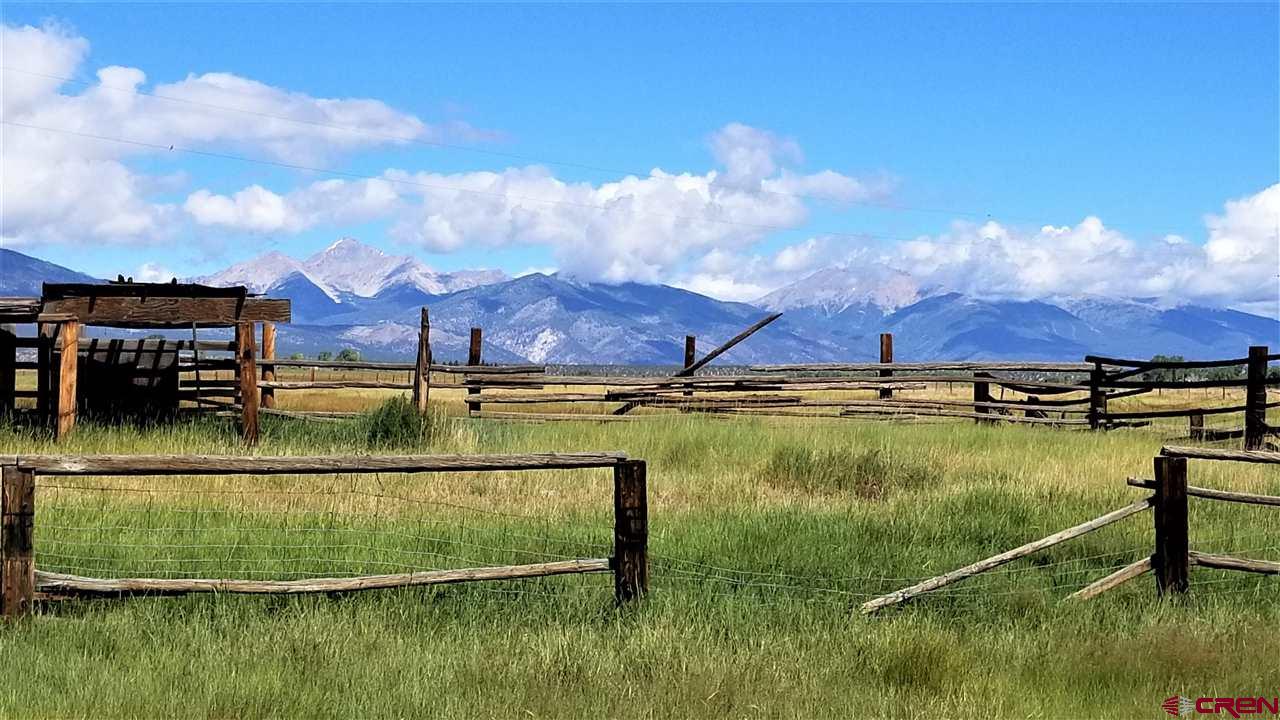 a view of a lake with a house in the background