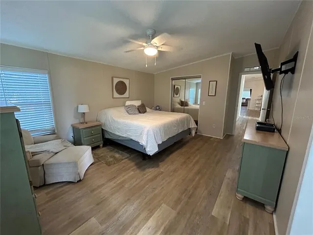 a large bathroom with a double vanity sink a large mirror and a bathtub