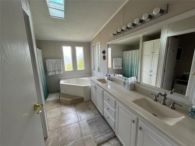 a bathroom with a bathtub and window
