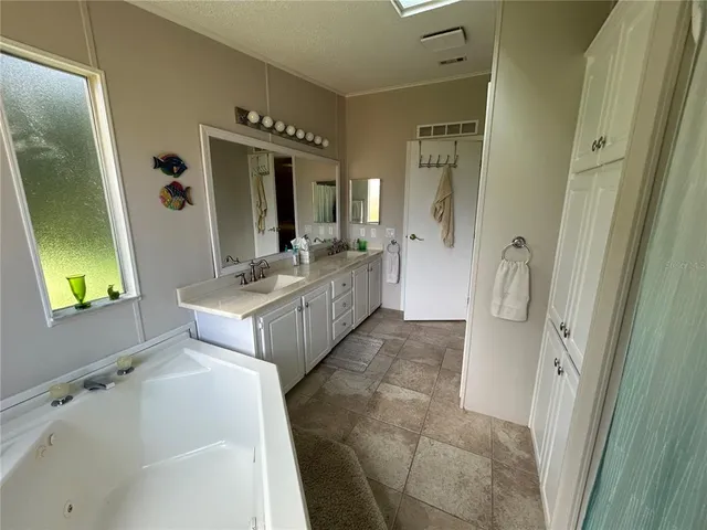 a white toilet sitting next to a bathroom sink