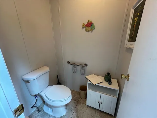 a view of a patio with table and chairs and potted plants