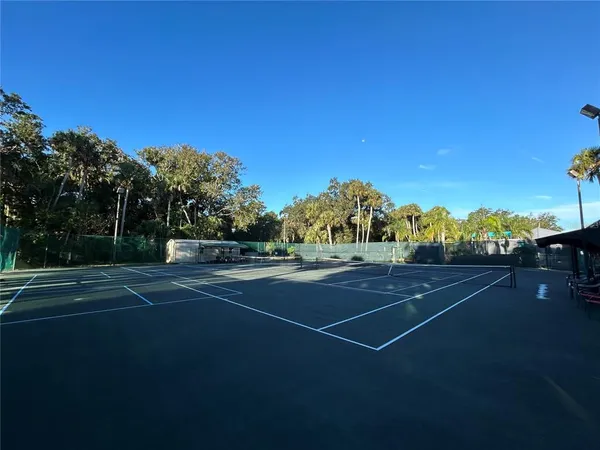 a view of balcony with two couches and wooden floor