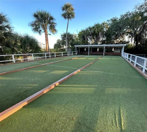a view of a dry yard with trees and stairs