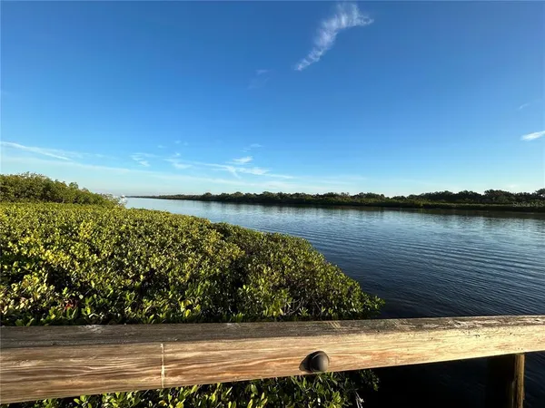 a sign that is on a brick wall