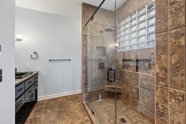 an empty room with an entryway and a window