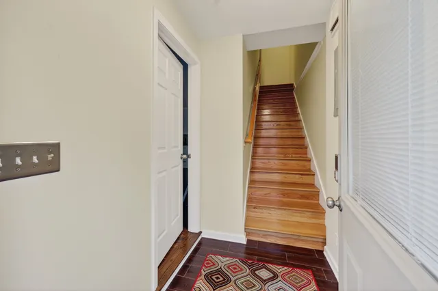 a view of a balcony with wooden floor and fence