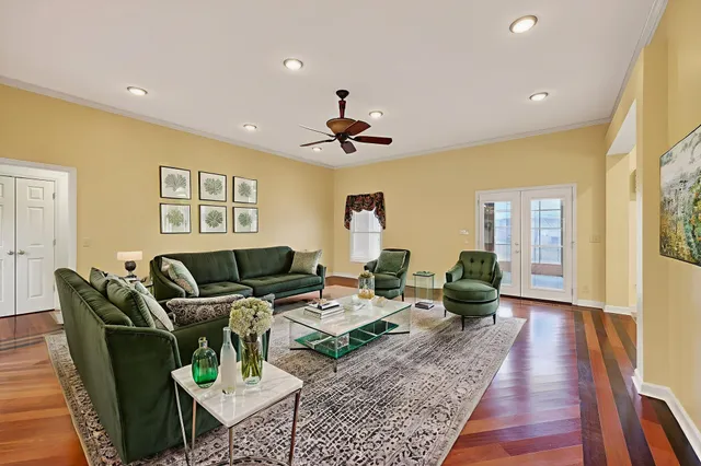 a kitchen with granite countertop a stove a sink and a refrigerator