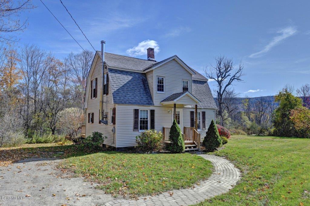 51 Anthony Road Richmond, MA 01201 - Photo 2 of 24 a front view of a house with garden