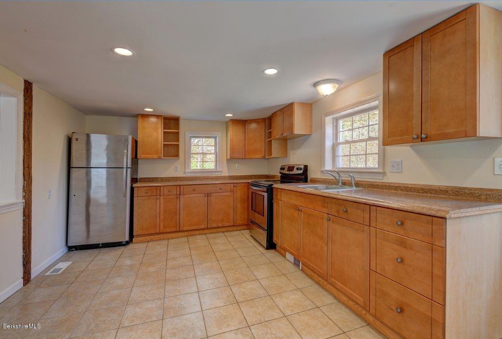 51 Anthony Road Richmond, MA 01201 - Photo 13 of 24 a kitchen with a refrigerator sink and cabinets