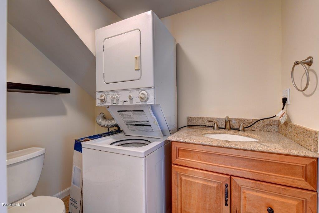 51 Anthony Road Richmond, MA 01201 - Photo 16 of 24 a bathroom with a granite countertop toilet sink and mirror