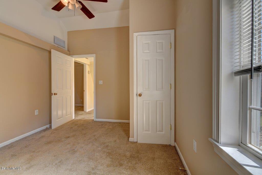 51 Anthony Road Richmond, MA 01201 - Photo 24 of 24 an empty room with ceiling fan and window