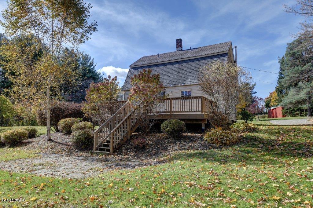 51 Anthony Road Richmond, MA 01201 - Photo 4 of 24 a view of a house with a yard and sitting area