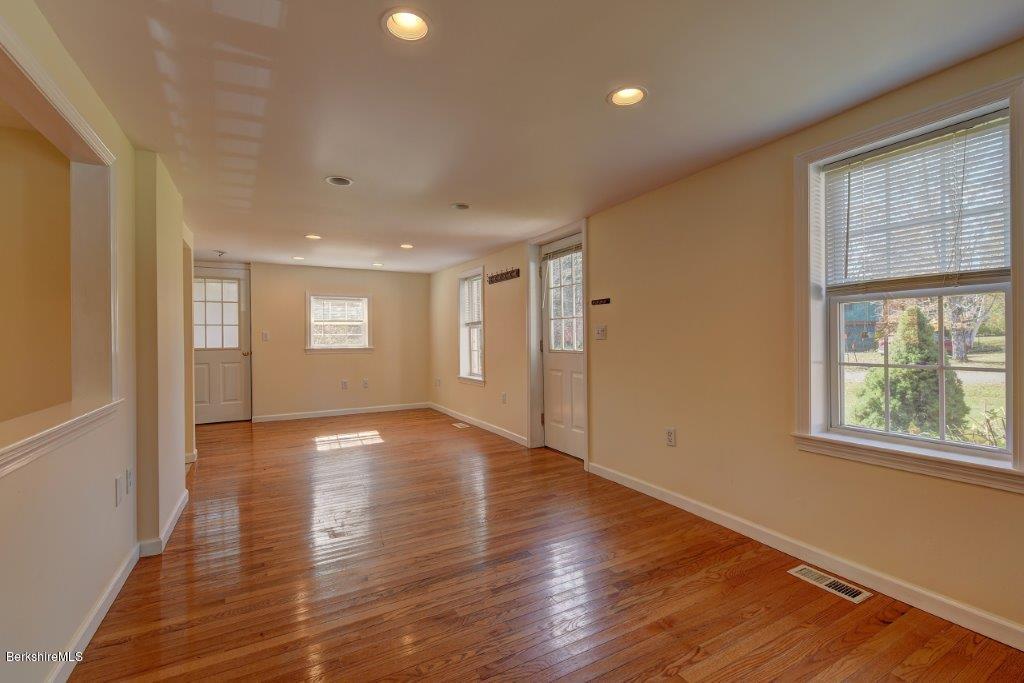 51 Anthony Road Richmond, MA 01201 - Photo 10 of 24 a view of an empty room with wooden floor and a window