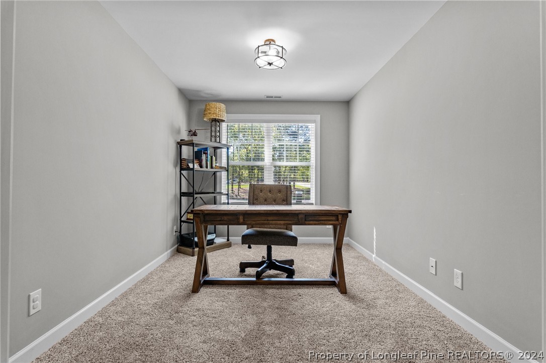 15420 Raccoon Run Road Wagram, NC 28396 - Photo 22 of 39 a view of a workspace with furniture