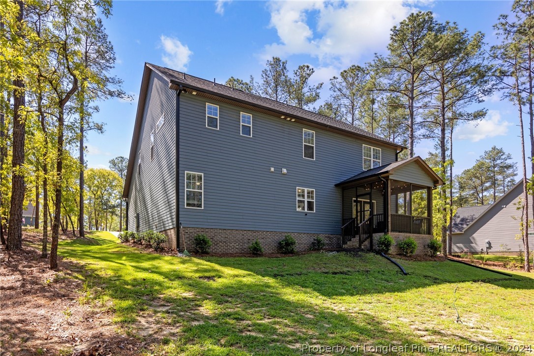 15420 Raccoon Run Road Wagram, NC 28396 - Photo 34 of 39 a front view of a house with garden