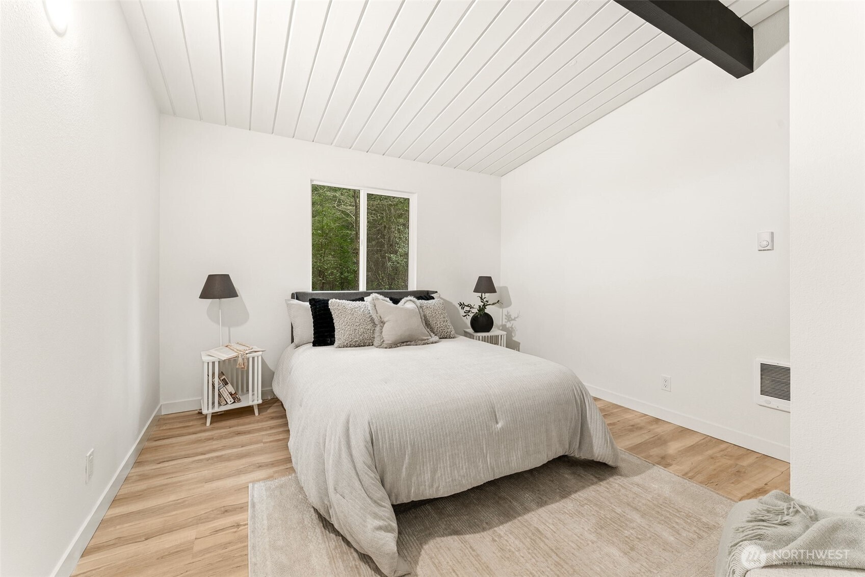 6198 Clover Valley Road Southeast Port Orchard, WA 98367 - Photo 13 of 34 a bedroom with a bed and a large window